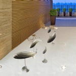Introduce a touch of ocean-inspired beauty to your home or garden with our stunning stainless steel fish sculpture